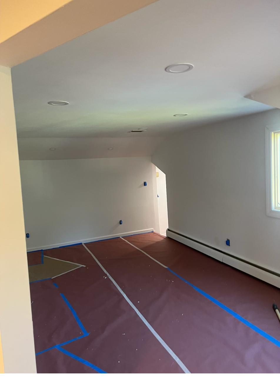 Room fully taped and prepped for painting